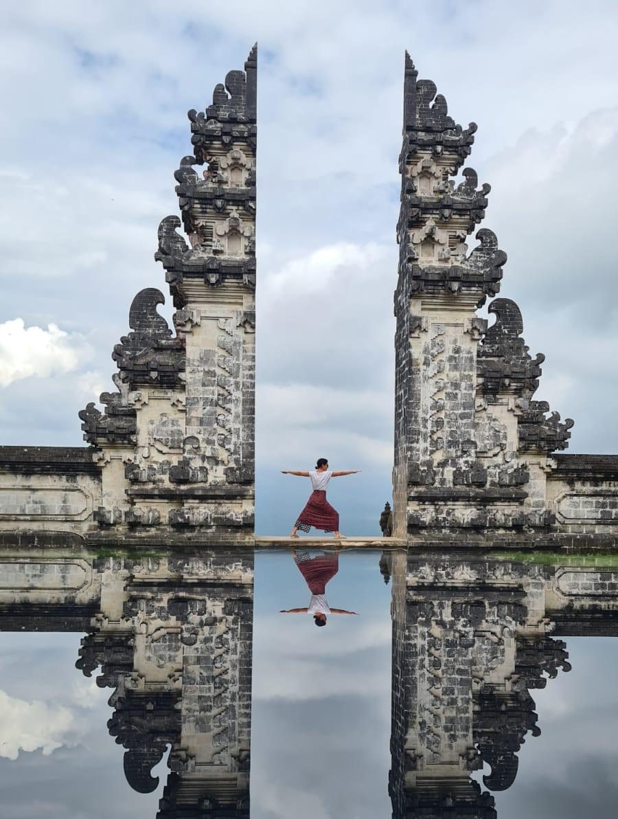 Yoga Bali student explores Goa Gajah, the iconic Elephant Cave in Ubud, during a transformative yoga teacher training.